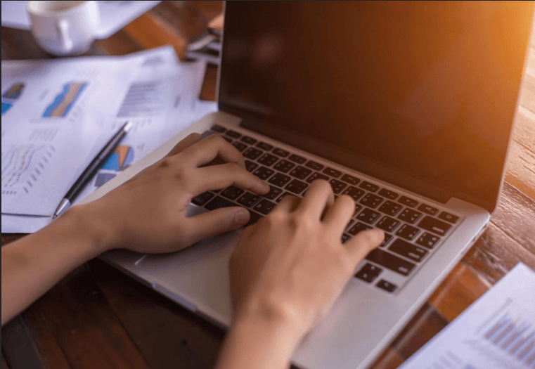 Financial reports and analytics on a laptop